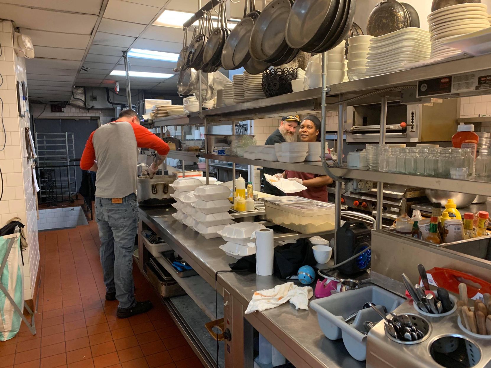 Three Monkeys staff prepare meals out of donated food coronavirus-19